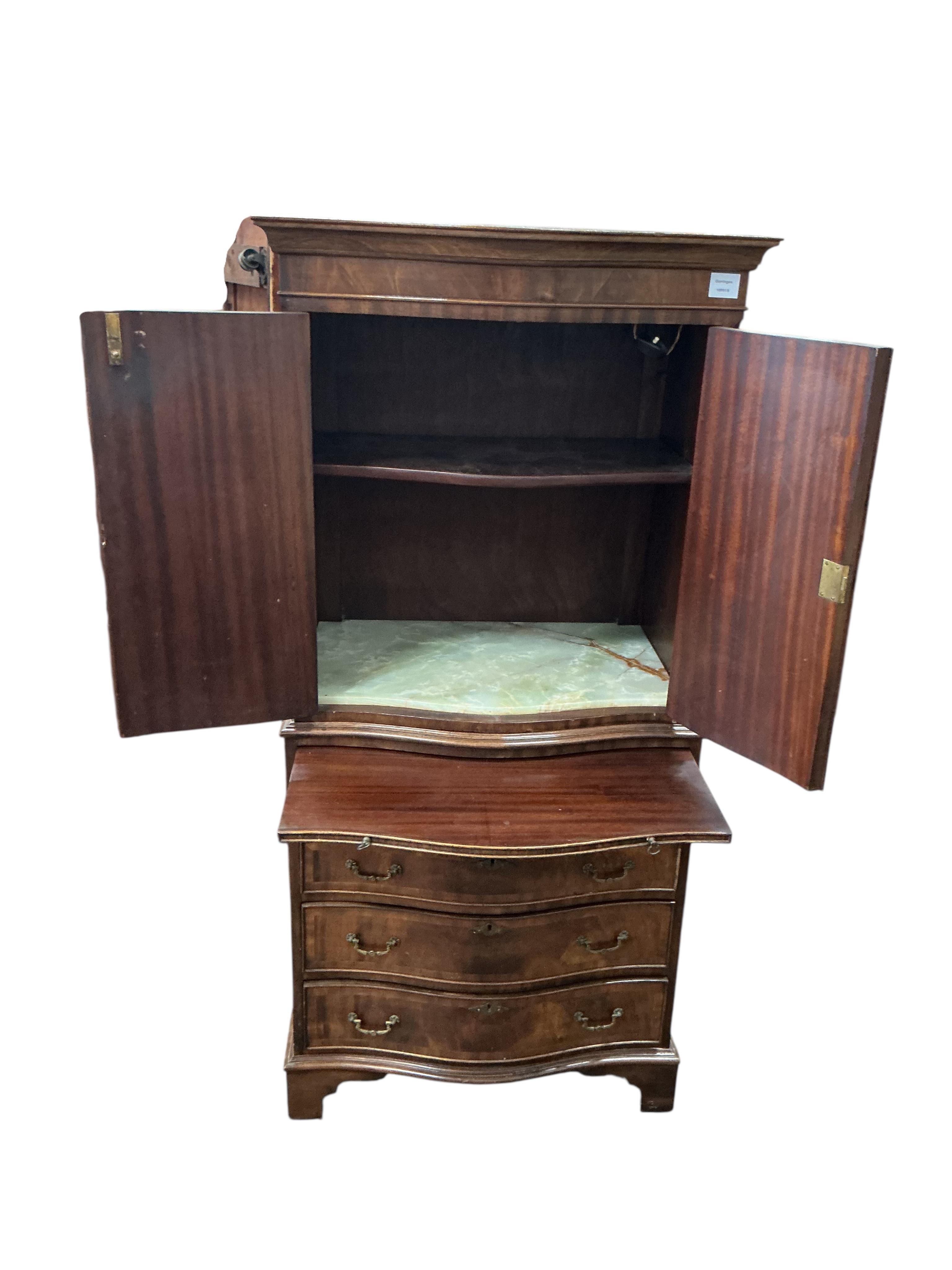 A reproduction George III style serpentine mahogany cocktail cabinet, width 71cm, depth 48cm, height 153cm